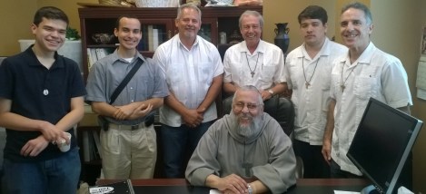 Brothers keep their superior company as he catches his breadth.  